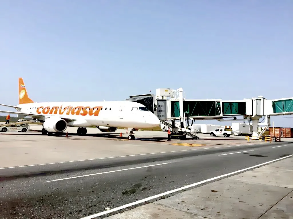 Boarding bridges and a Conviasa aircraft at Maiquetía International Airport, Venezuela