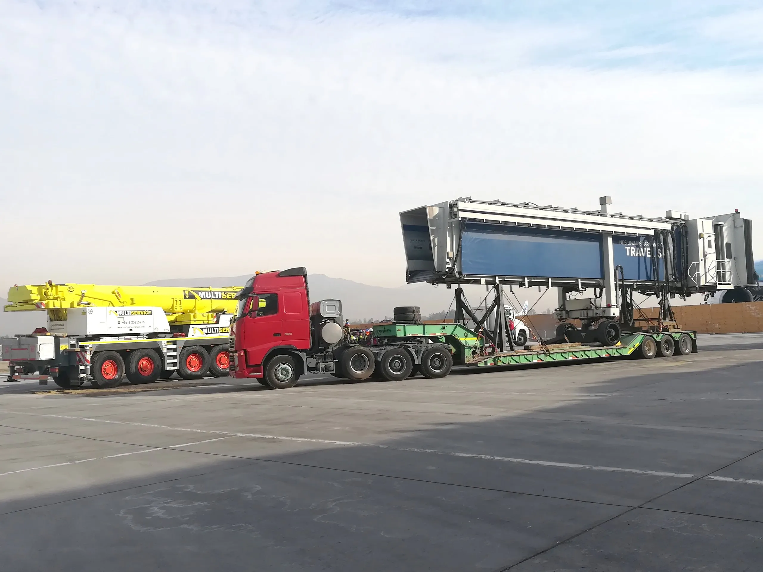 Heavy machinery and airport equipment being moved