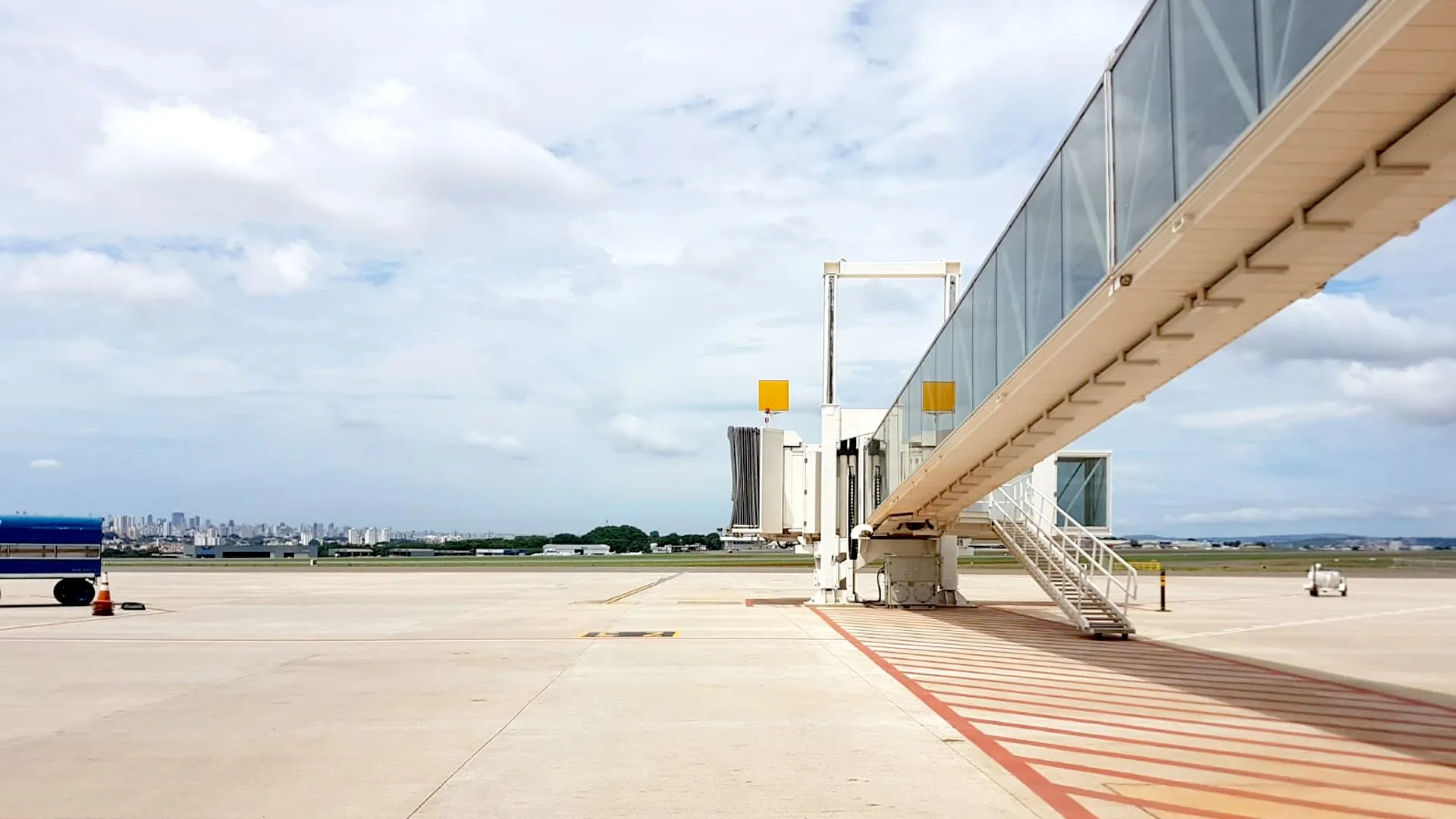Passenger boarding bridge docked on the apron
