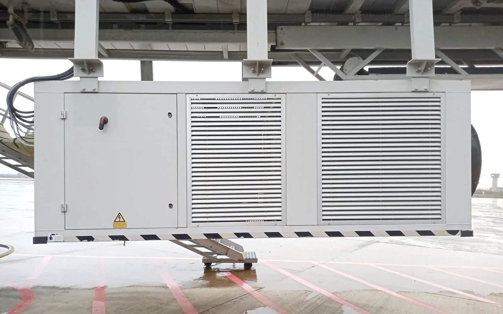 Pre-conditioned air unit (PCA) installed under a boarding bridge