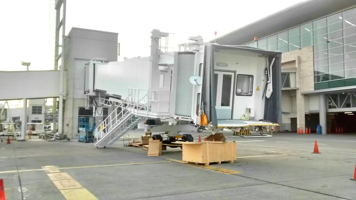 Boarding bridge attached to the terminal at an airport in Ecuador