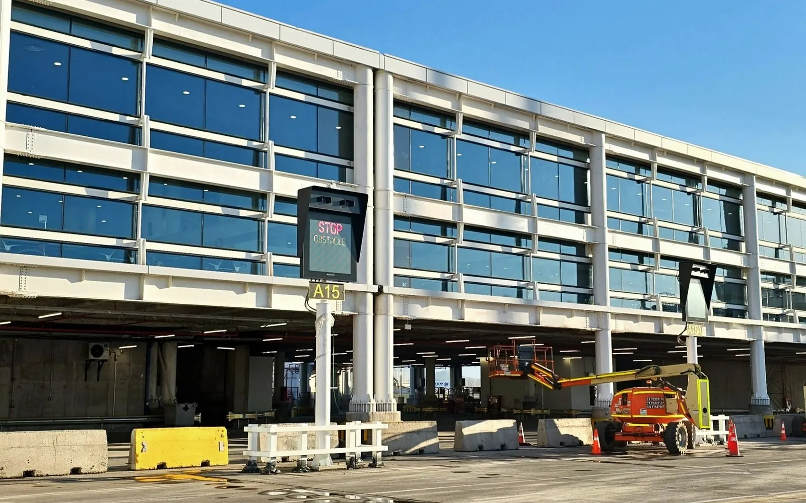 Visual docking guidance system (VDGS) display on a terminal facade, facing the aircraft stand